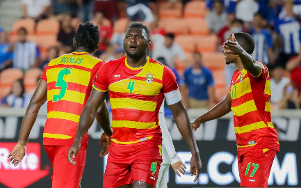 Grenada players protest a refereeing decision against Honduras
