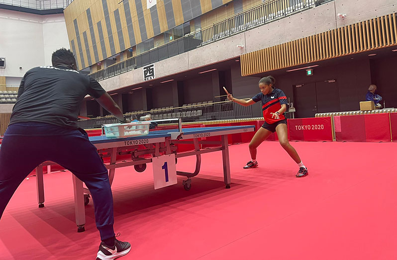 Getting it right! Coach Idi Lewis and Chelsea Edghill during their first training session at the Tokyo Metropolitan Gymnasium.