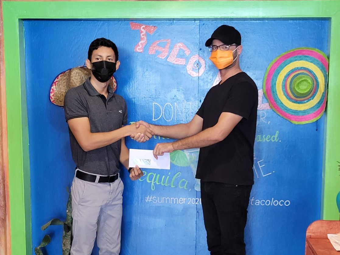 Miguel Wong (left) accepts the support from Taco Loco’s Kian Jabour yesterday.