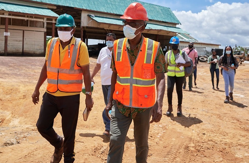 Operations Manager of Vaitarna Private Holdings Incorporated (VPHI), Shaheed Mohammed, and Labour Minister, Joseph Hamilton in discussion during an inspection of the company’s worksite (Samuel Maughn photo)