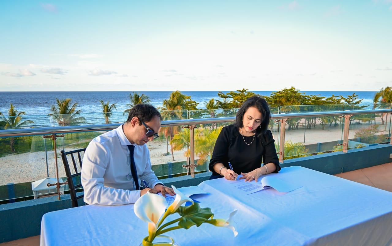 President of the American Chamber of Commerce of Trinidad & Tobago (AmCham T&T), Toni Sirju-Ramnarine (right), and President of the American Chamber of Commerce of Guyana (AmCham Guyana), Zulfikar Ally (left) signing the Memorandum of Understanding on Friday here in Georgetown, Guyana