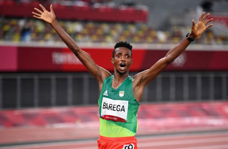 Ethiopia's Selemon Barega celebtates his stunning victory in the men's 10 000 metres on Friday.