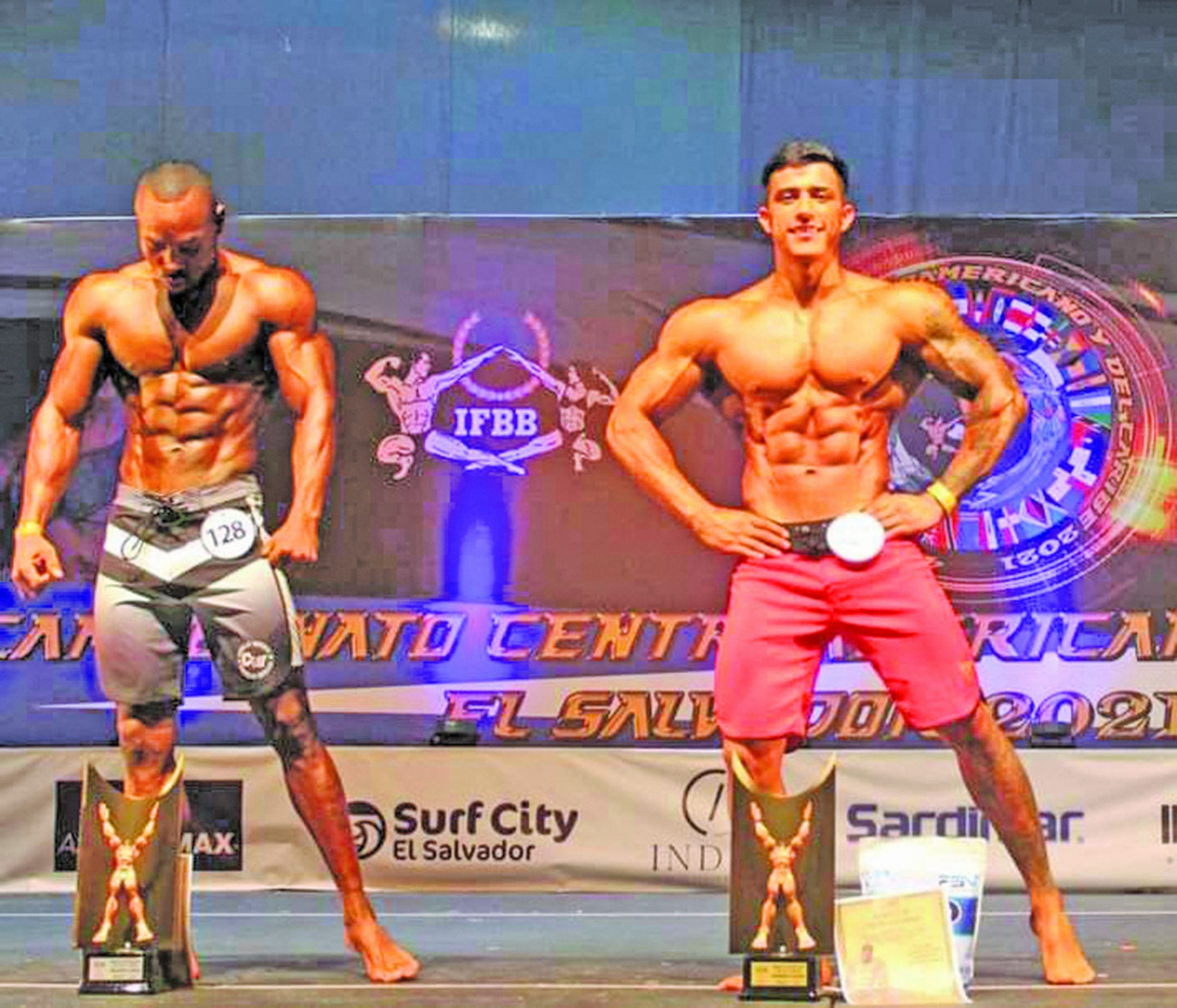 Guyana’s Emmerson Campbell (left) once again narrowly misses out on CAC Men’s Physique gold.