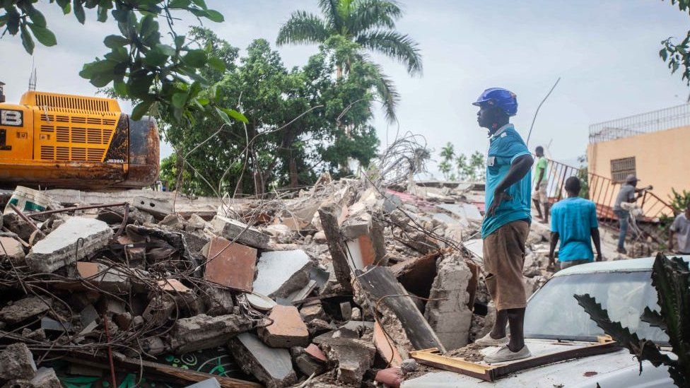 Rescue crews are still digging through rubble in a search for survivors, as the stench of death fills the air (BBC/GETTY IMAGES)