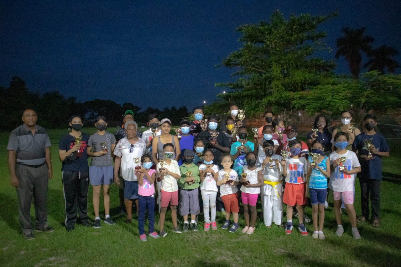 GGA president Aleem Hussain along with members, coaches and students take a photo following the end of the camp.