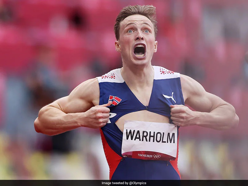 Karsten Warholm of Norway wins the men's 400-metre hurdles, setting a world record.