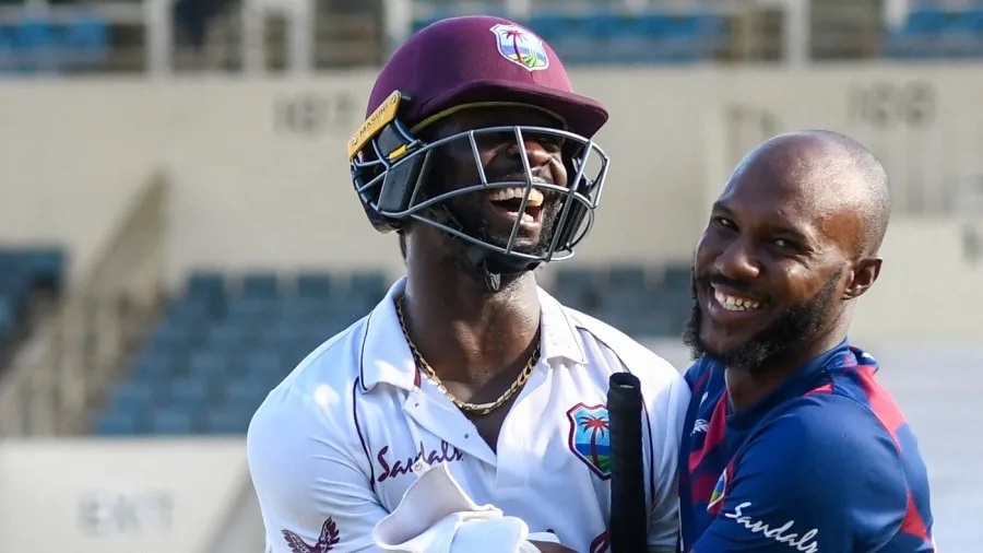 Kemar Roach and Jermaine Blackwood, heroes of West Indies' triumph, enjoy the winning moment ( AFP/Getty Images)
