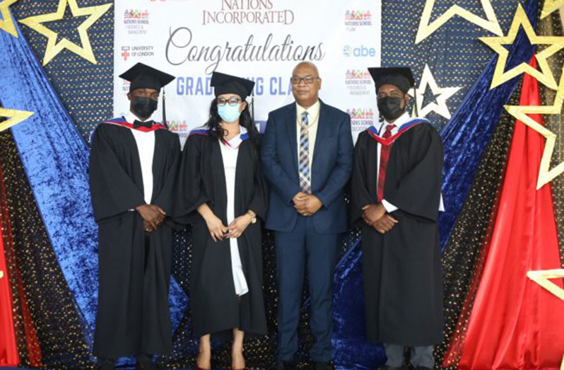Minister of Public Works, Bishop Juan Edghill, with some of the graduates (DPI photo)