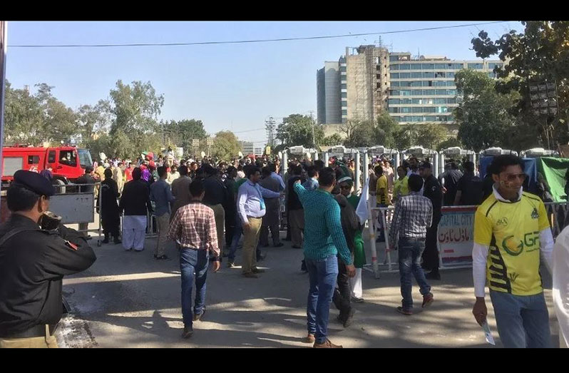 People queue up outside the gates at the Gaddafi stadium for the PSL final ( ESPNcricinfo Ltd./Umar Farooq)