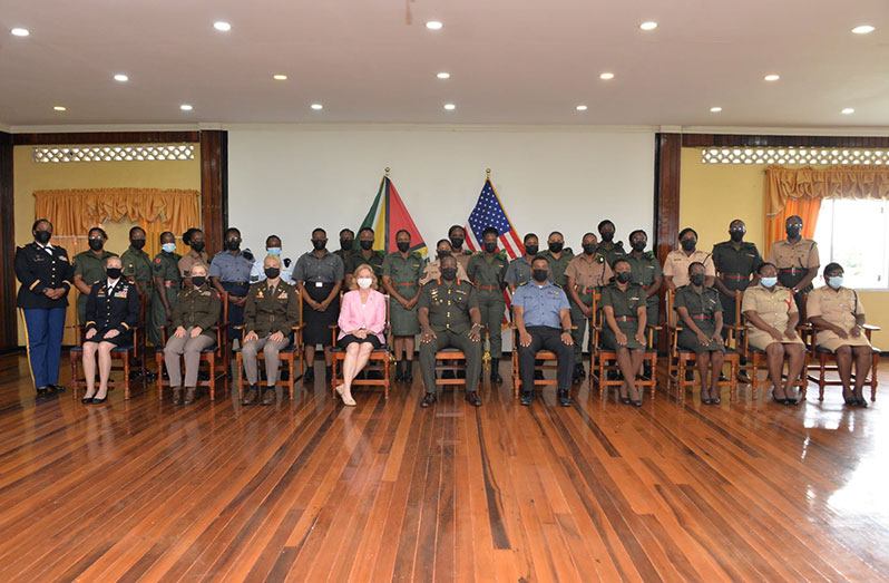 U.S. Ambassador to Guyana, Sarah-Ann Lynch (seated fourth from left) and Chief of Staff of the GDF, Brigadier Godfrey Bess (seated at centre) with the participants and facilitators of the Women, Peace and Security Workshop