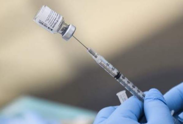 A syringe is filled with a first dose of the Pfizer COVID-19 vaccine at a mobile vaccination clinic during a back to school event offering school supplies, COVID-19 vaccinations, face masks, and other resources for children and their families at the Weingart East Los Angeles YMCA in Los Angeles, California on August 7, 2021. (Photo: AFP)