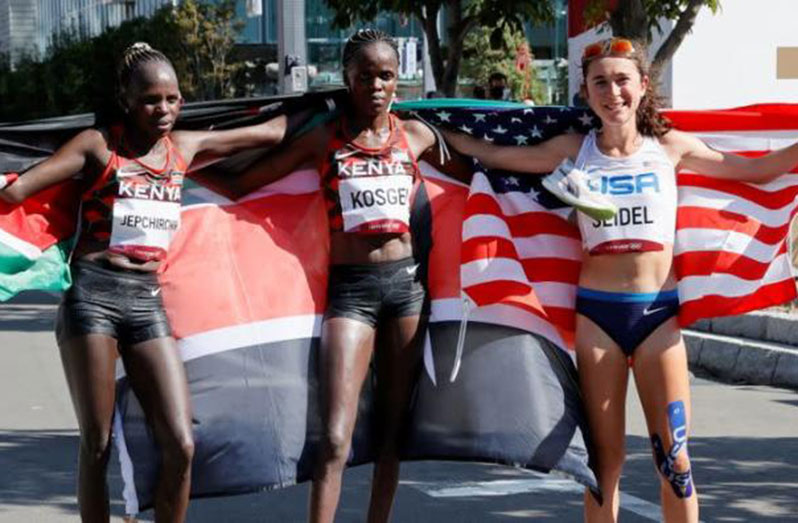 Women’s marathon winners from left: Brigid Kosgei (silver) Peres Jepchirchir (gold) and Molly Seidel (bronze)