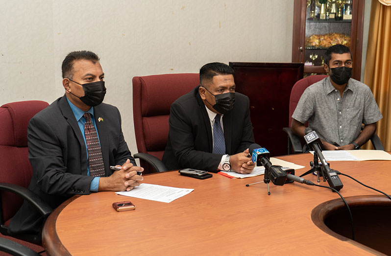 From left: CEO of Go-Invest, Dr. Peter Ramsaroop; Agriculture Minister, Zulfikar Mustapha, and CEO of Umami, Chris Persaud, engaging members of the media before signing the MoU on Tuesday (Delano Willams photo)
