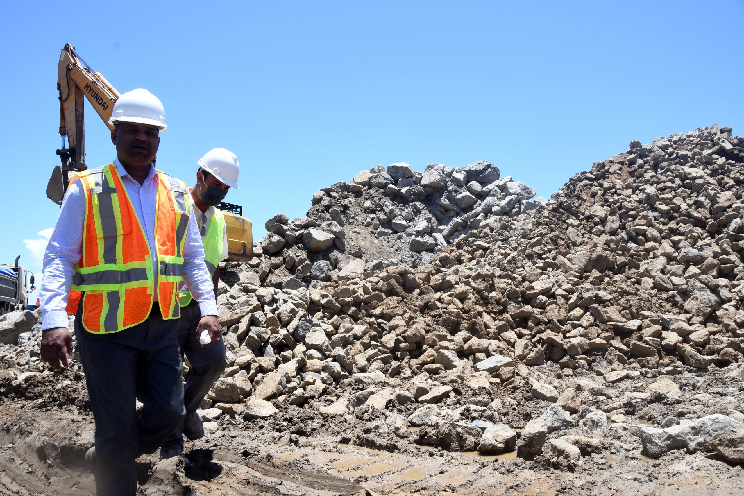 Minister of Public Works, Deodat Indar, (left) on site at the construction of a riprap sea defence, along the West Coast of Demerara (Adrian Narine photo)
