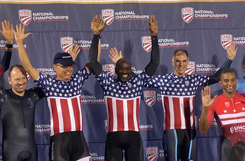 Golden! James Joseph (centre) with teammates Dave Morgan and Edwin Slaughter celebrating on the podium after winning the 2021 USA Cycling.