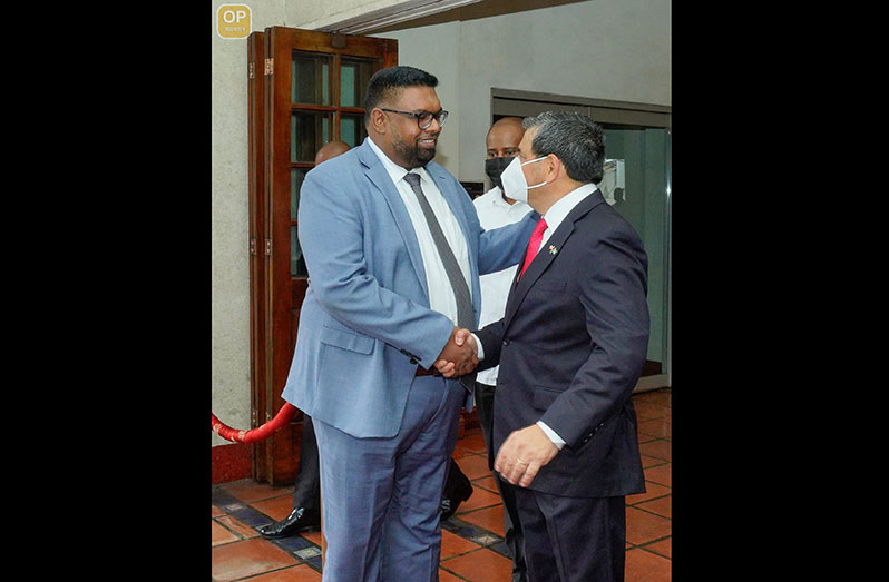 President, Dr. Irfaan Ali, is greeted by Chilean Ambassador to Guyana, Juan Manuel Pino Vasquez, at the Pegasus Hotel (Office of the President photo)