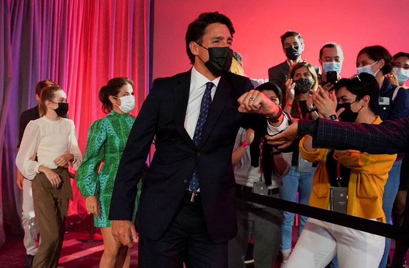 Canada's Liberal Prime Minister, Justin Trudeau, greets supporters during the Liberal election night party in Montreal, Quebec, Canada, September 21, 2021 (REUTERS/Carlos Osorio)
