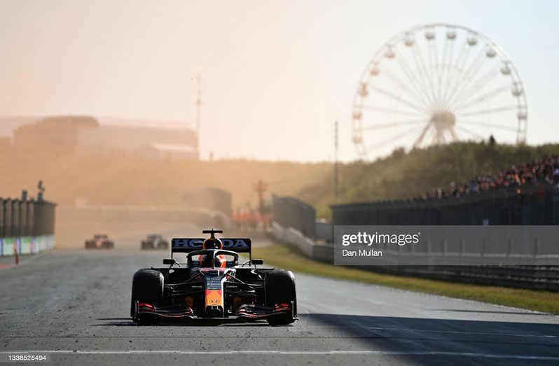 Race winner Max Verstappen of Netherlands and Red Bull Racing celebrates as he drives into Parc Ferme during the F1 Grand Prix of The Netherlands at Circuit Zandvoort on September 05, 2021 in Zandvoort, Netherlands. (Photo by Dan Mullan/Getty Images)