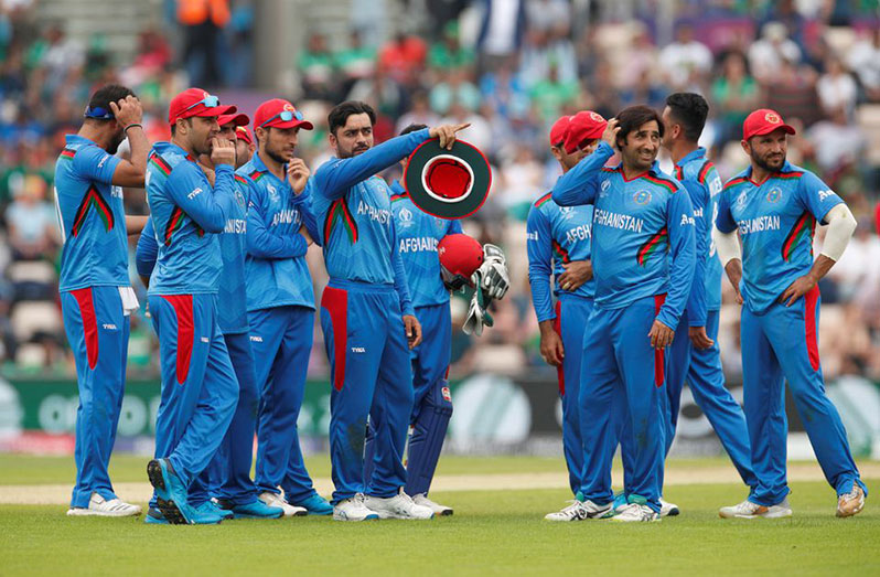 Afghanistan's Rashid Khan and team mates watch a review on the big screen during the match against Bangladesh (Action Images via Reuters/John Sibley)