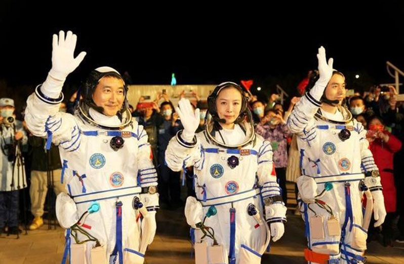 A see-off ceremony for three Chinese astronauts of the Shenzhou-13-crewed space mission is held at the Jiuquan Satellite Launch Center in northwest China, Oct. 15. Chinese astronauts, Zhai Zhigang (left), Wang Yaping (middle) and Ye Guangfu (right) will stay in space for about six months (Xinhua/Li Gang)