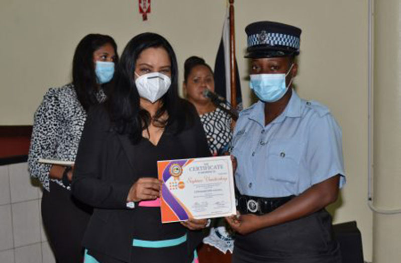 Human Services and Social Security Minister Dr. Vindhya Persaud, presents a certificate to one of the participants (DPI photo)
