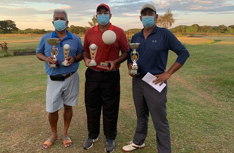 Videsh Persaud (centre) won the Trophy Stall competition last Saturday. He is flanked by the second- and third-place finishers, Hilbert Shields (left) and Ayube Subhan
