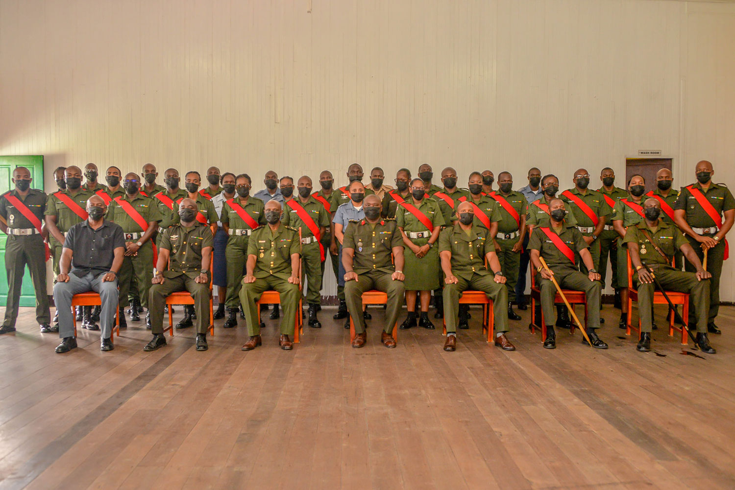 Inspector-General, Colonel Kenlloyd Roberts (centre front) flanked on his left by Commanding Officer Training Corps, Lieutenant Colonel Collin Henry and on his right by Officer Commanding SLC, Major Andre Cush, along with staff and students of SLC 10