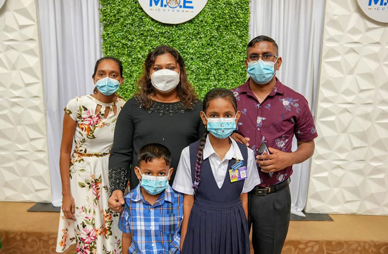 Nitya Narine and her parents Vishal and Fareza Narine along with her brother and Minister of Education, Priya Manickchand at the NGSA announcement ceremony on Friday (Ministry of Education photo)