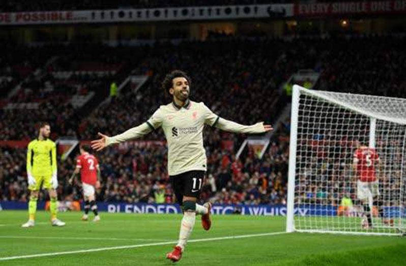 Liverpool's Egyptian midfielder Mohamed Salah celebrates after scoring their fifth goal, his third during the English Premier League football match between Manchester United and Liverpool at Old Trafford in Manchester, north-west England, yesterday. (Photo: AFP)