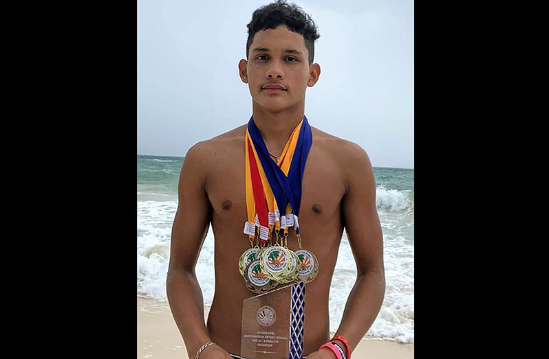 Decorated! Guyana’s Vladimir Woodroffe showing off his ‘silverware’ following his sensational showing at this year’s BSA International Invitational Swimming Championships.