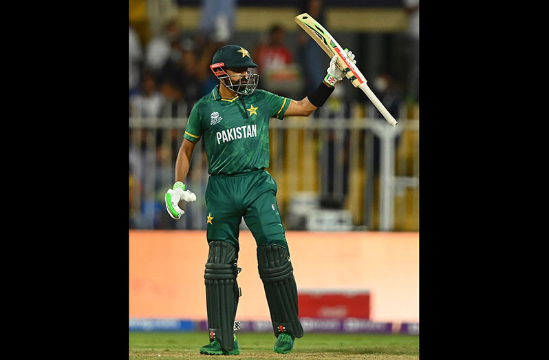 Babar Azam raises his bat after getting to a half-century, Pakistan vs Scotland, T20 World Cup, Group 2, Sharjah, November 7, 2021 © Getty Images