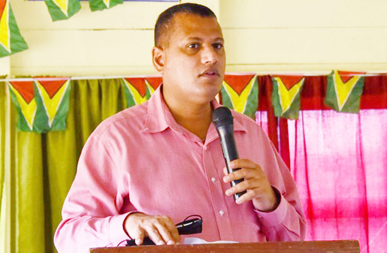 Minister of Housing and Water, Collin Croal, addressing the residents of Region Seven