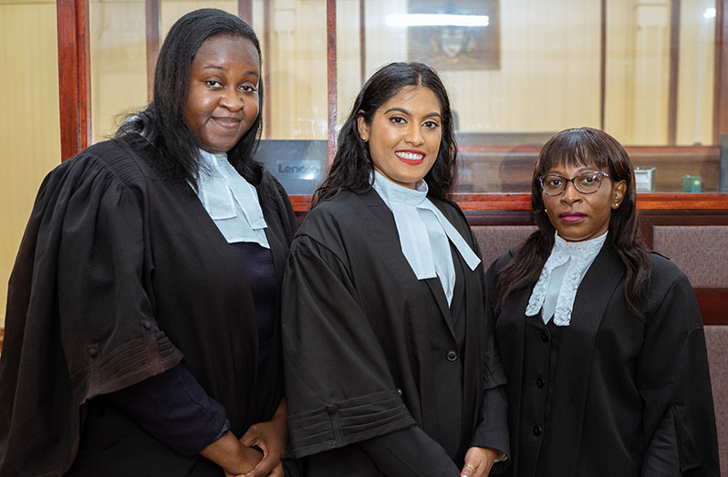Devi Seitaram, centre, after being accepted to practise Law here. With her are fellow Attorney-at-Law, Tuanna Hardy, left, and Justice Simone Ramlall