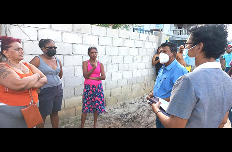 GWI’s CEO, Shaik Baksh engaging residents of Gooharoo Road recently (DPI photo)