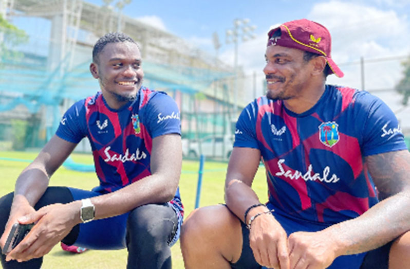 Jayden Seales (left) shares a light moment with fellow fast bowler and Trinidadian Shannon Gabriel