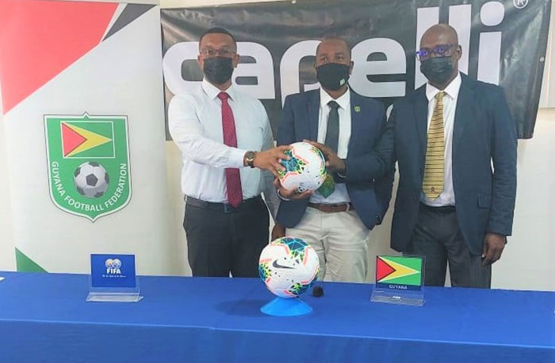 Kashif Muhammad and fellow K&S Organisation Director Aubrey ‘Shanghai’ Major join GFF president Wayne Forde to announce the GFF/K&S ‘Super 16’ Year-End tournament. (Rawle Toney photo)