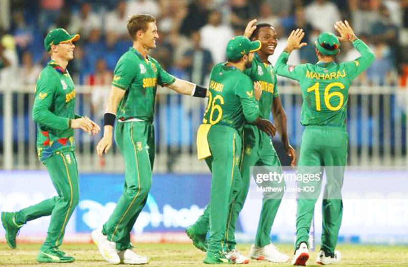 Kagiso Rabada of South Africa celebrates after dismissing Chris Jordan to claim a hat-trick during the ICC Men's T20 World Cup match versus England at Sharjah Cricket Stadium yesterday, in Sharjah, United Arab Emirates (Photo by Matthew Lewis-ICC/ICC via Getty Images)