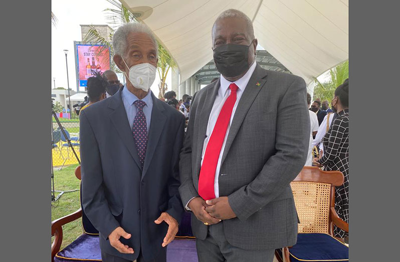 Prime Minister, Brigadier (Ret'd), Mark Phillips interacts with renowned West Indies cricketer, Sir Garfield Sobers