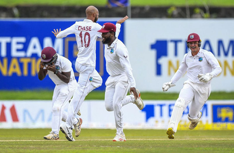 The West Indian players celebrate the run-out of Dimuth Karunaratne, Sri Lanka vs West Indies, 2nd Test, Galle, 3rd day, yesterday (AFP/Getty Images)