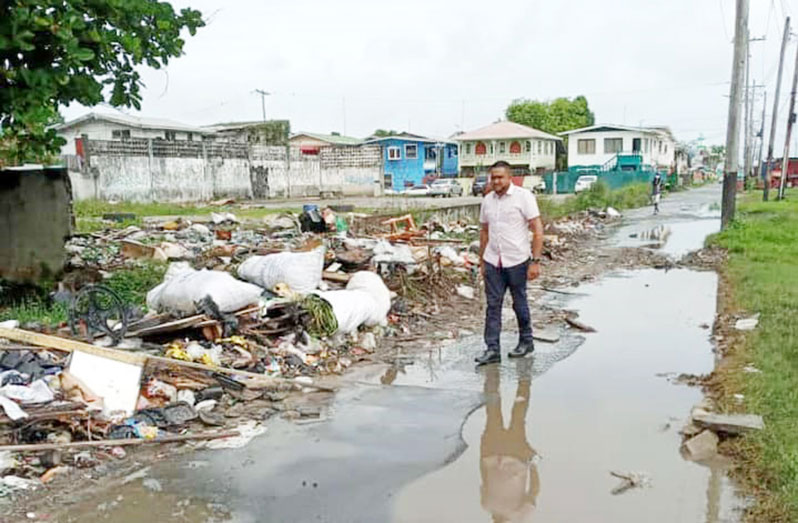 Minister of Local Government and Regional Development, Nigel Dharamlall assessing the impact of the flood and the garbage situation in Albouystown, Georgetown on December 12, 2021 (Photo sourced from Minister Nigel Dharamlall’s Facebook Page)