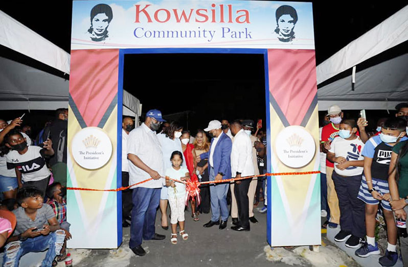 President Dr. Irfaan Ali assisting with the cutting of the ribbon to declare open the Kowsilla Community Park at Leonora, West Coast Demerara
