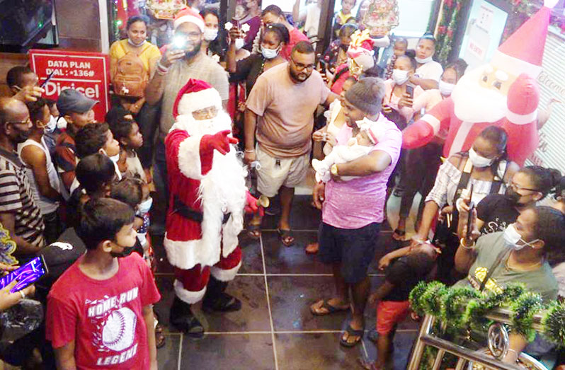 Santa Claus distributes gifts