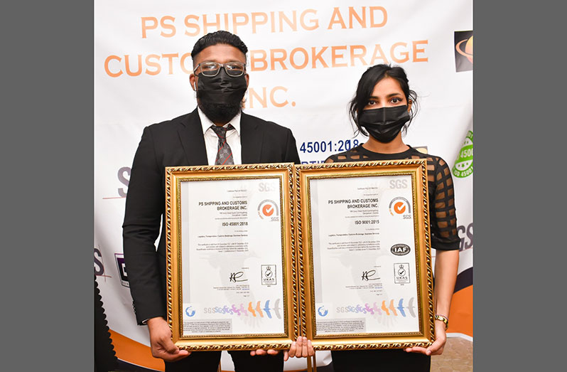 CEO of PS Shipping and Customs Brokerage (PSSCB) Inc, Phil Surooj and his wife Alisha Singh display the two ISO certificates received