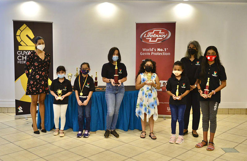 First-ever U12 female champion, Kristin Xavier, (fourth from left) and other winners of the Girls’ U12, U10 and U8 divisions