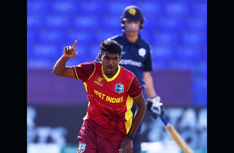 Fast bowler Shiva Sankar peels away in celebration after taking one of his three wickets against Scotland.