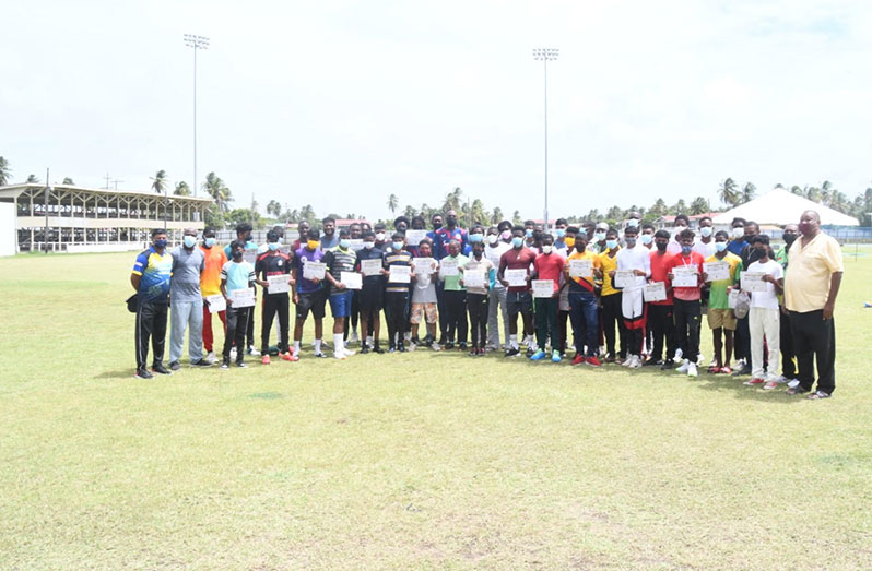 Sir Curtly Ambrose and BCB president Hilbert Foster pose with over 60 fast bowlers from Berbice and Georgetown