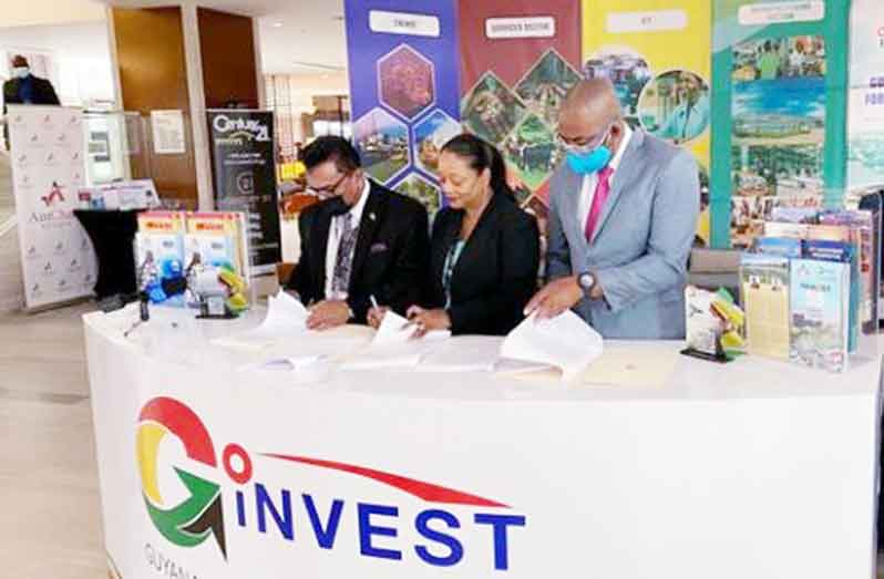 Go-Invest’s CEO, Dr. Peter Ramsaroop (first from left); CEO of Invest Barbados, Kaye-Anne Brathwaite (center) and CEO of Export Barbados, Mark Hill sign a MoU