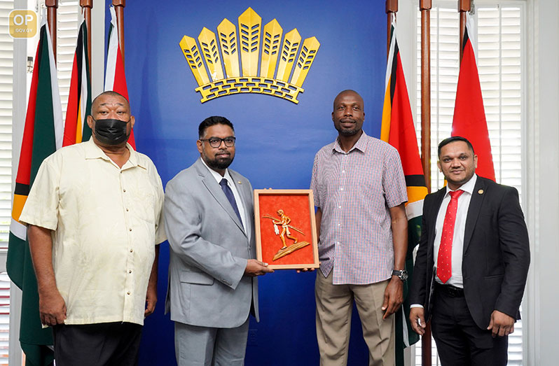 President of Guyana Irfaan Ali (second from left) meets Sir Curtly Ambrose (second from right) this morning at State House. Also in the photo are BCB president Hilbert Foster (left) and Minister of Natural Resources, Vickram Bharrat