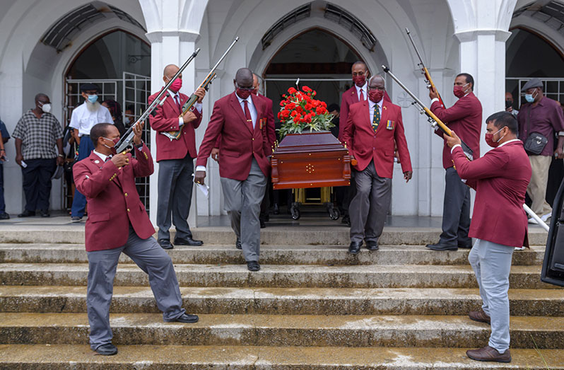 GNRA members form an arch with their rifles as the casket was borne out of the Brickdam Cathedral, (Delano Williams photo)