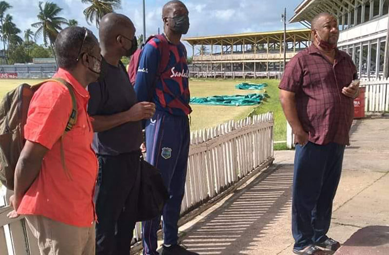 BCB president Hilbert Foster (extreme right) addresses the opening of the Dr Frank Denbow fast-bowling clinic. Sir Curtly Ambrose (third from left) looks on.